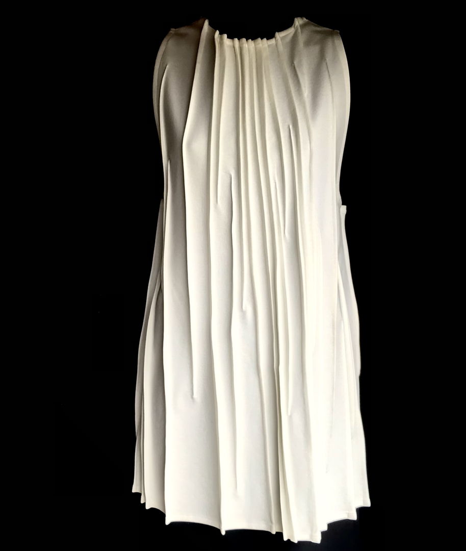 Linear details throughout garment. Surface design is created with folding and stitching. Each is individually done and uniquely its own.