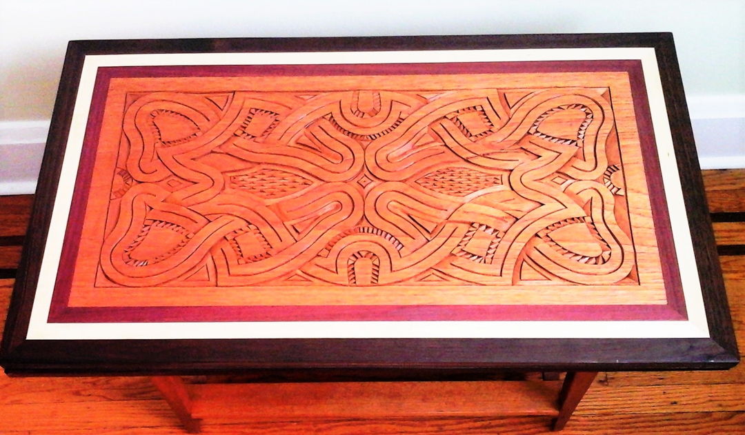 This carving design represents the currents of the rivers that are the center of life in the Amazon- they are the natural highway; food source- fishing  water for bathing and crop raising  and laundry; ever present as they flow beside and between our villages... now so threatened by climate change... seen with a table base made of cedar