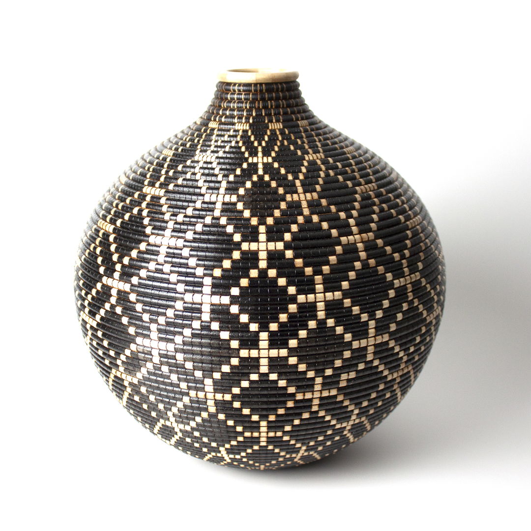 Turned and hollowed Maple vessel embellished with pyrography and hand-dyed with archival ink to give the appearance of a woven basket.