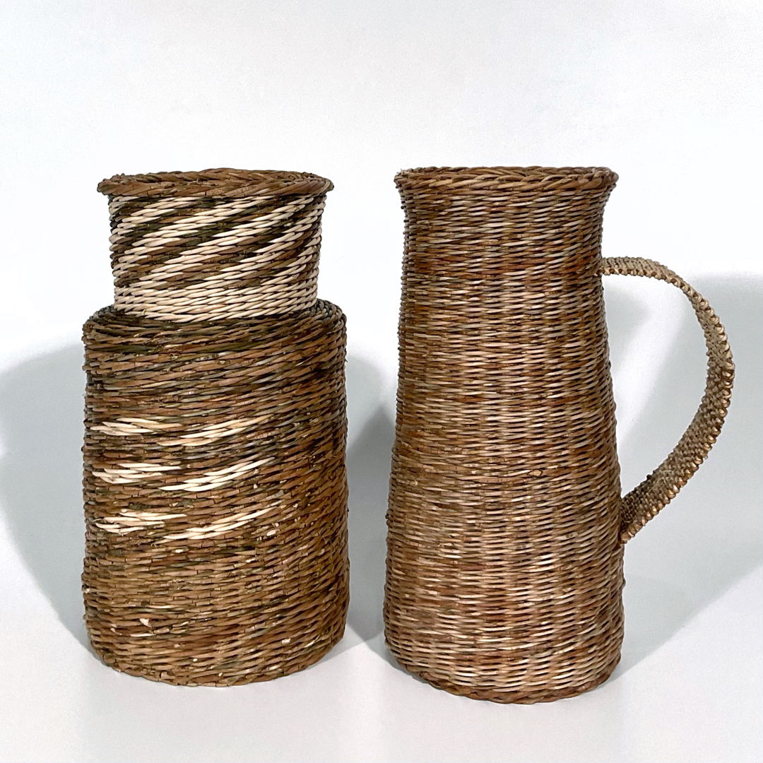 Locally gathered Akebia vines. The browns are all natural colors  the off white is the same material but the bark has been stripped off.