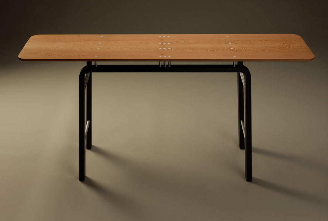One-of-a-kind console table. Quartersawn and bookmatched American sycamore floats above an ebonized beech base on 10 anodized aluminum posts. Trios and singles of aluminum tubes  spaced in the same arrangement as in the table top  connect the front and back frames of the base.
