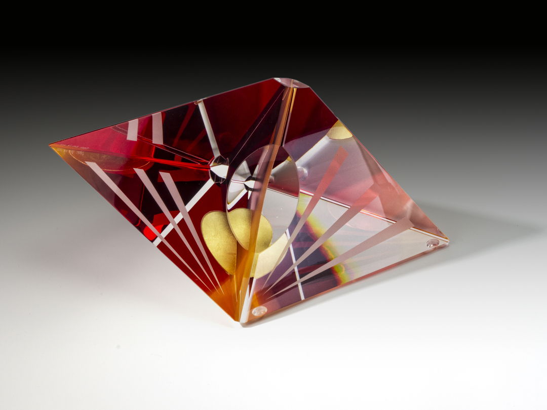 Optical glass that has been cold-worked: a centuries old Bohemian technique using no heat  but rather room temperature glass is shaped using water and abrasives in conjunction with lapidary tools. The techniques involved are cutting  grinding  polishing  laminating and coloring.