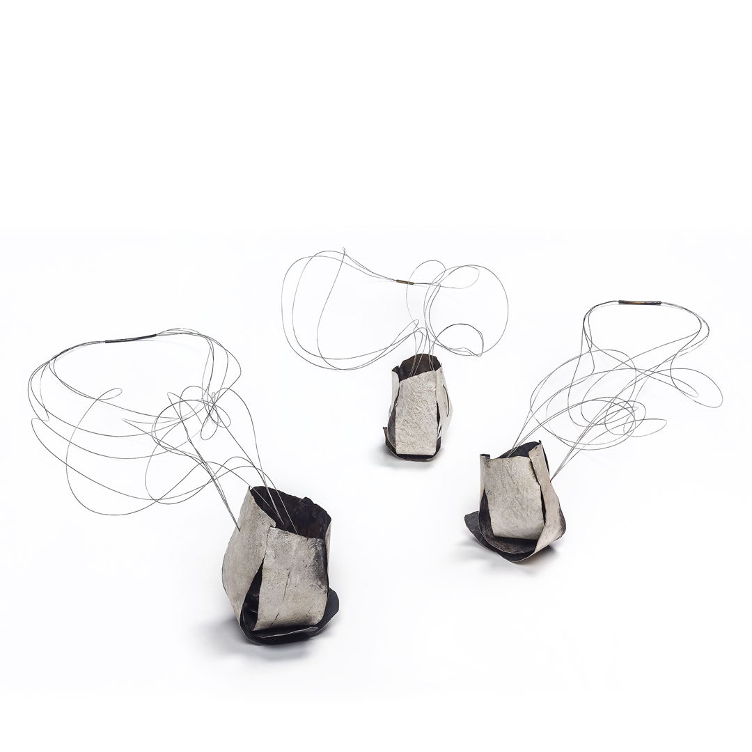 Necklace SS. Nylon coated stainless steel wire. Hammered  Heated patina and Oxidized.