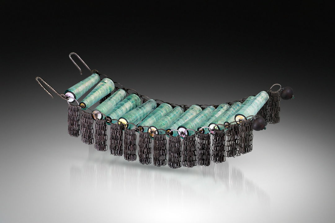 Bracelet made from glass beads hand-formed in the flame using dichroic glass. Frame made from oxidized sterling silver  acetate  with hammered silver closure.