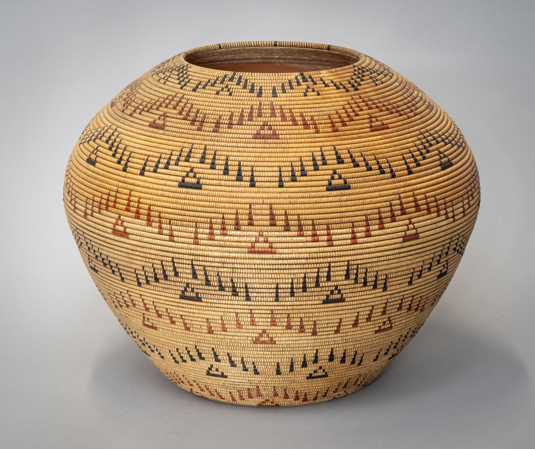 A wood treasurer basket turned on a wood lathe. Embellished with India Ink and a burning pen. Original Native American baskets used fiber that was dark brown to black and a red fiber they harvested in nature. My colors are to resemble the colors they used.