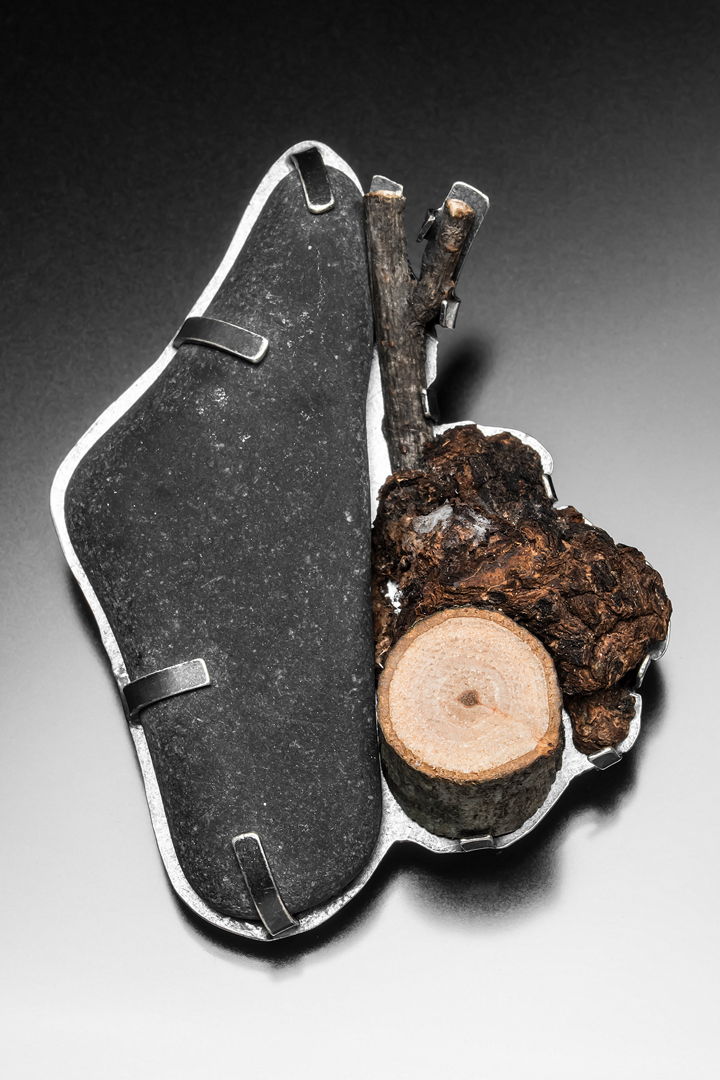 Hand fabricated brooch in sterling silver with rock and burl wood
