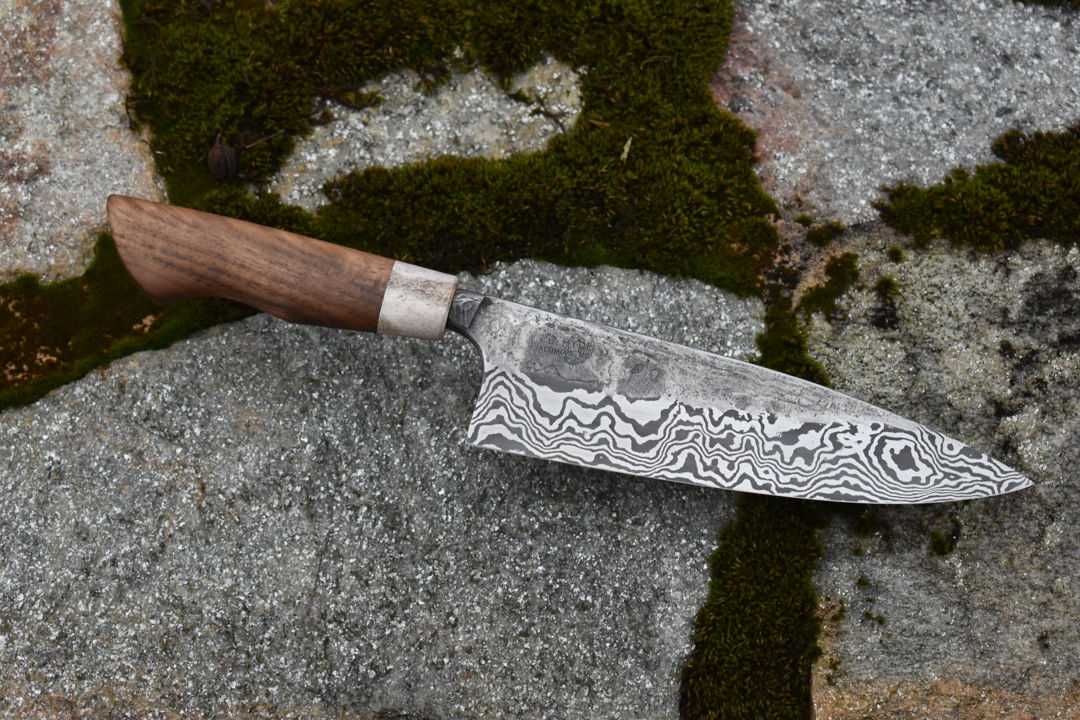7" chef knife with low-layer damascus steel blade. Handle is Whitetail Antler and Walnut  both sourced from Maryland.