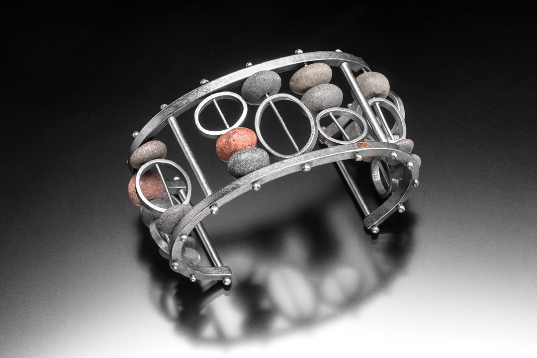Hand fabricated sterling silver bracelet with rocks from Lake Superior.