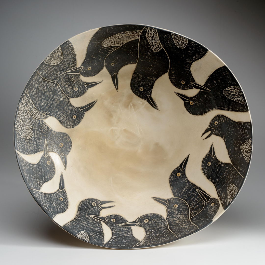 bowl depicting many birds around rim