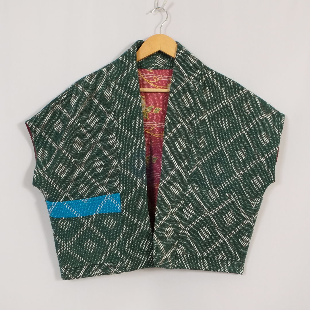 Woven into every Anoushka Jacket is the legacy of the Kantha—a traditional Bengali quilt hand-stitched from worn saris and fabrics  revived into new life. Each piece is singular  carrying the marks of time  touch  and craft. With a reversible design and a silhouette shaped by Asian street style  the jacket embodies OTTO FINN’s vision: heritage reimagined for the present.