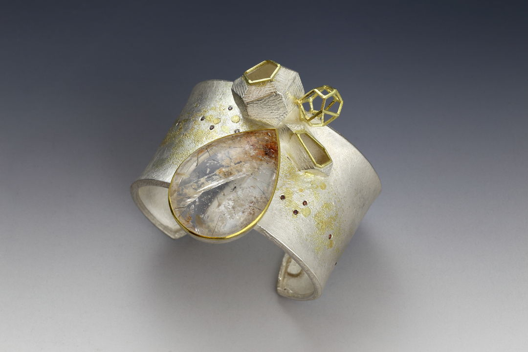 scenery that has the feeling of the Chinese traditional landscape painting by using the solid forms and the wire structure. 22 k &amp; 18k gold  sterling silver  quartz  diamonds