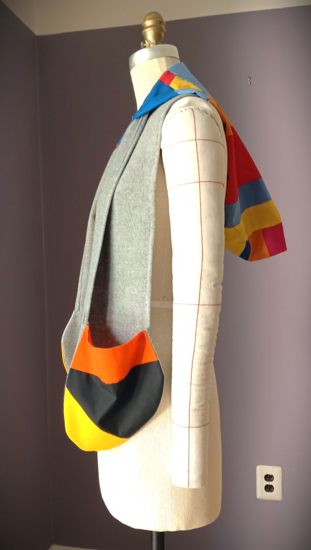 Experience the artistry of contrast in the Cromuff Cowl  grey wool drape  QUILTED cotton pockets  and a hood reimagined for modern life. Elegant  functional  unforgettable. The hood adds a sculptural element  shifting easily between function and form. More than an accessory  it’s a piece that moves with you — fluid  functional  and unmistakably yours.