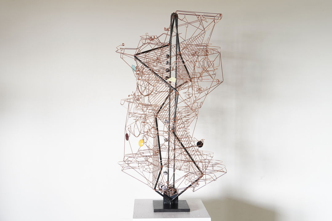 Copper wire and steel kinetic sculpture. Glass marbles (Handcrafted by Aaron Slater) are lifted to the top of the sculpture and roll down four possible paths interacting with eight kinetic elements. Kiln-fired  enamelled copper parts function as counterweights to moving elements.