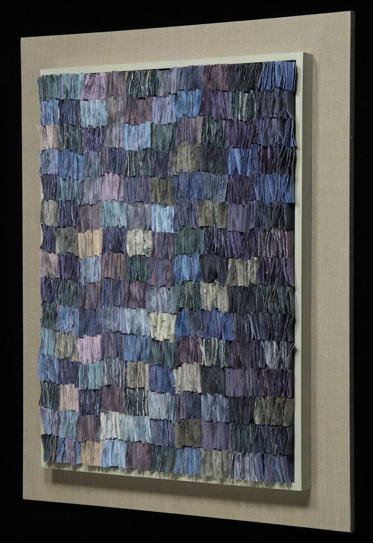 Handmade paper is pigmented  double-sided  folded and attached to a linen backing. Artwork has a different design depending on being viewed from left or right.