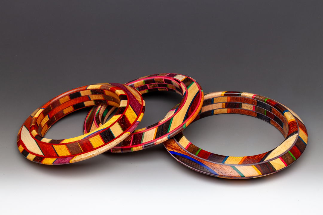 The new "Unbound" series created in 2024. the laminate comprised of bold natural wood colors and dyed Maple veneer. The hardwoods are all sustainably harvested throughout the world