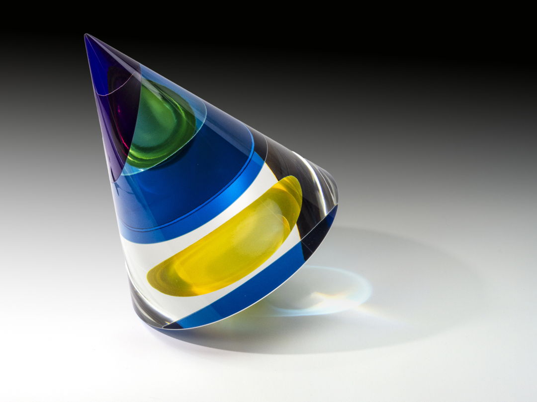 Optical glass that has been cold-worked: a centuries old Bohemian technique using no heat  but rather room temperature glass is shaped using water and abrasives in conjunction with lapidary tools. The techniques involved are cutting  grinding  polishing  laminating and coloring.