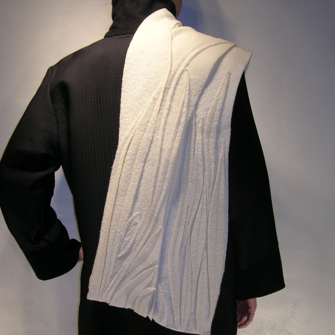multiple shapes applied &amp; sewn to create sculpted texture and design on boiled wool scarf