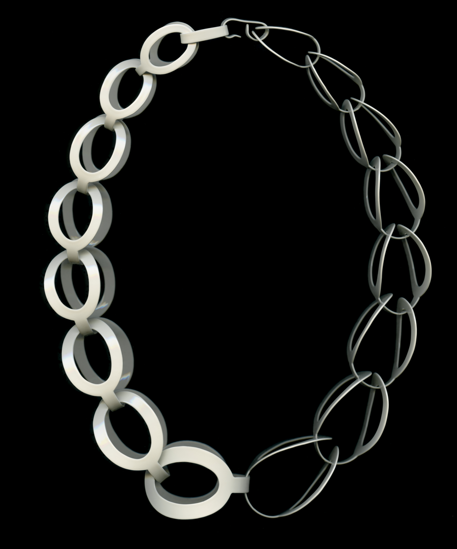 Neckpiece hand pierced and hand formed from brass sheet metal and powder coated cream.