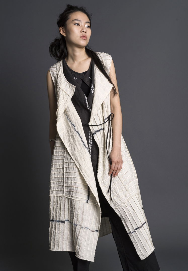 Hand-dyed shibori using sustainable dyes and linen. Deconstructed  pieced  stitched. Hand-patterned. Constructed with couture finishing by hand and machine. Worn with Cocoon Jinbaori.