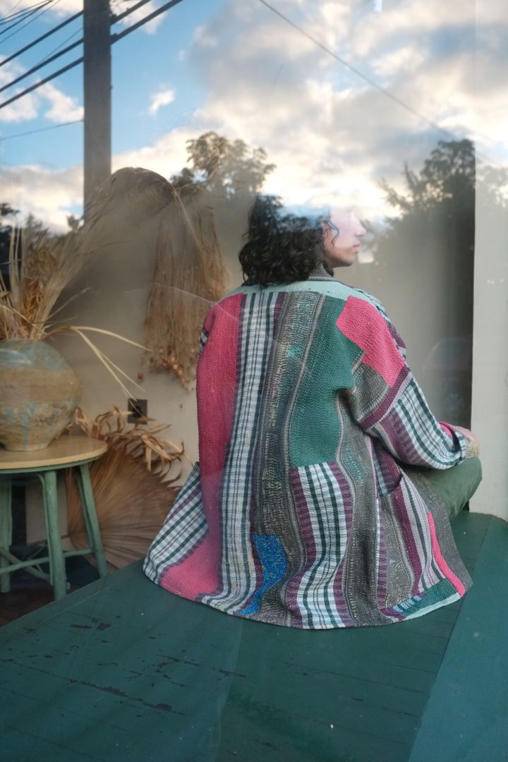 Made with traditional Bengali quilts called "Kanthas " expertly crafted from repurposed saris and fabrics  each Anoushka Jacket is a unique creation curated for your utmost comfort. These reversible jackets feature gender-neutral sizing and embrace a silhouette inspired by Asian street style.