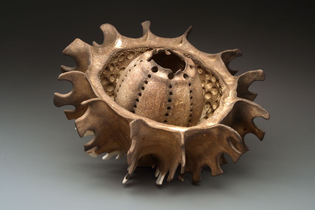 porcelain vessel with carved gash down the center