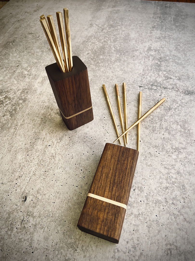 Forged brass cocktail picks with walnut and brass holder.