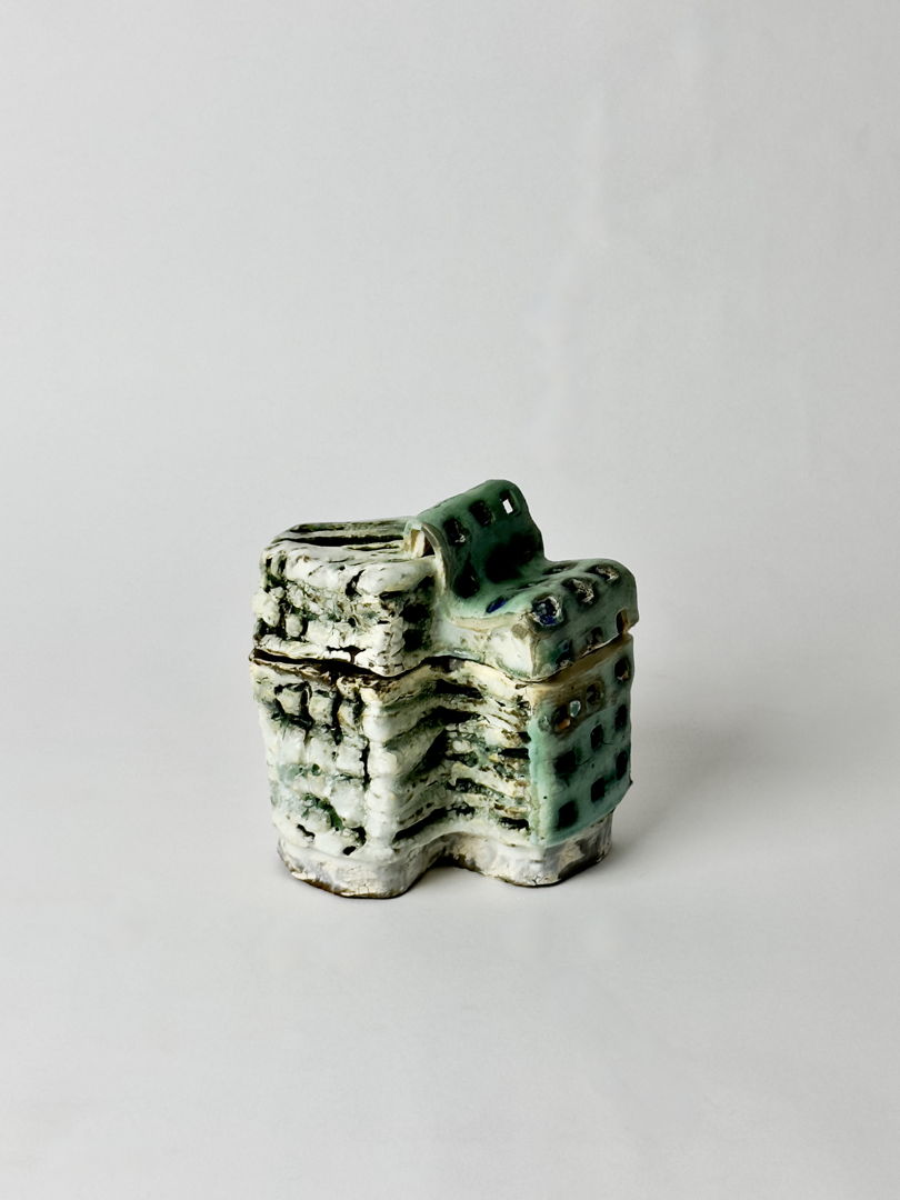 Hand-built stoneware and porcelain kurinuki-carved box  with slips and glazes.