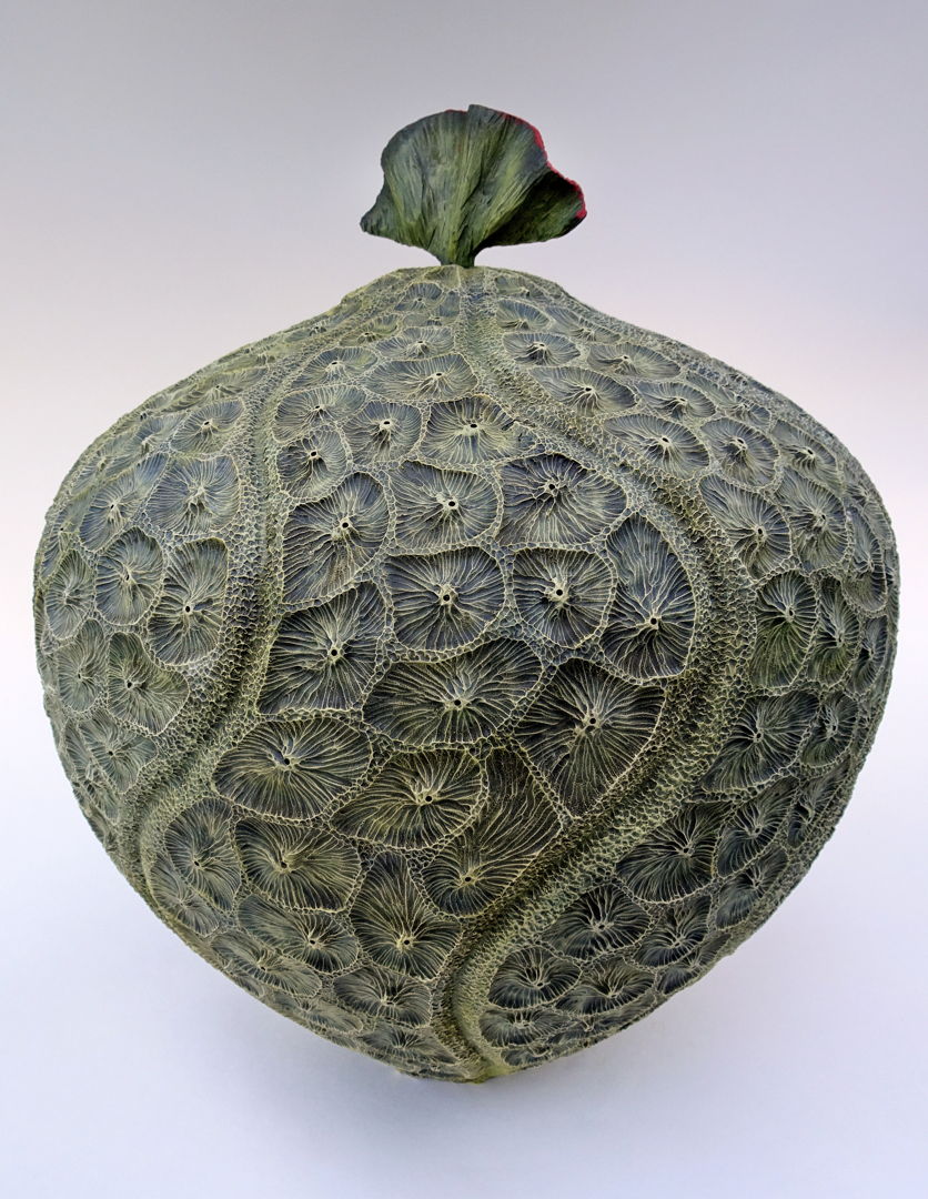 Maple vessel; turned  carved  textured  acrylic paints.