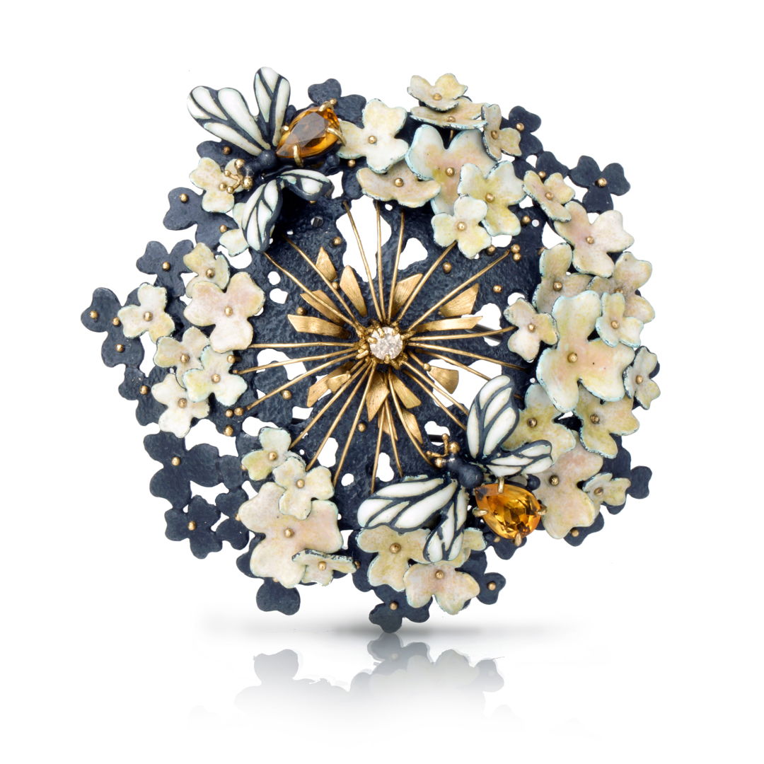 modern approach to traditional enameling art. All enamels are kiln fired vitreous enamels. Two lovely bees with delicate enamel wings are flying among clusters of flowers which have rich color variations. The center of the flower is highlighted with 18k gold details and a sparkling white diamond.