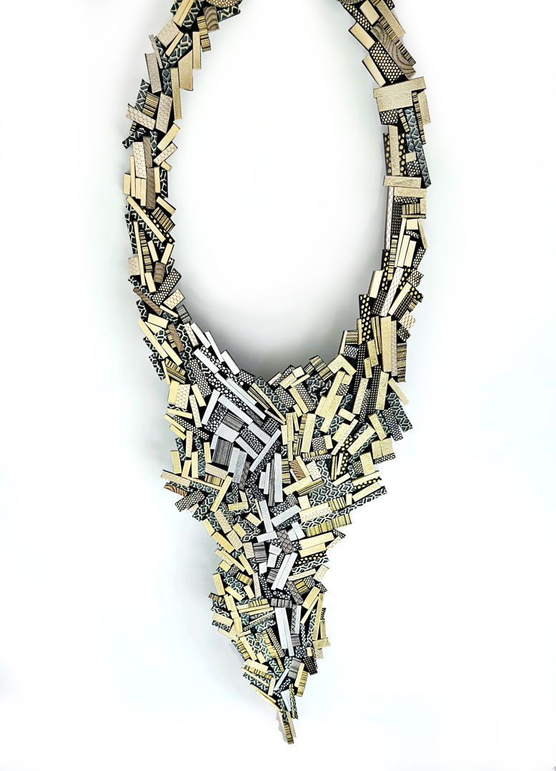 This one of a kind art piece is assembled hundreds of small leather pieces like a wild mosaic. Like a crazy quilt  once you start  you never really know how the piece will look like when it is finished. All small pieces are set on a soft leather backing. The closure is a hidden magnet clasp.