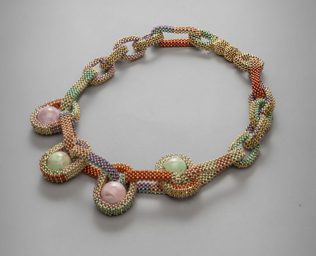 Necklace with magnetic closure part of the collection Pods. handwoven with fine 24K gold plated and Toho duracoat seed beads. Vintage marbled lucite spheres are nestled in the bead mesh in place of gems. Ongoing collection  limited edition available in various color combinations.