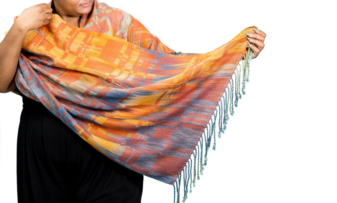 Handwoven shawl  hand painted warp and hand dyed tencel a sustainable yarn from Eucalyptus trees. Woven in original pattern on a floor loom. Colors and pattern pay homage to the Blue Earred Kingfisher with vibrant oranges blues and teal.