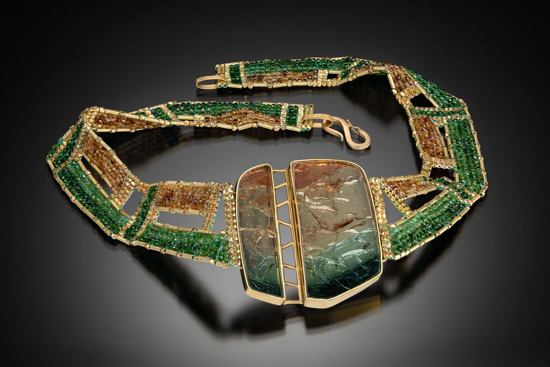 Hand woven collar with multicolor tourmaline and 20k gold beads. Hand fabricated bezel with 22k gold  set with two matching tourmaline slices.