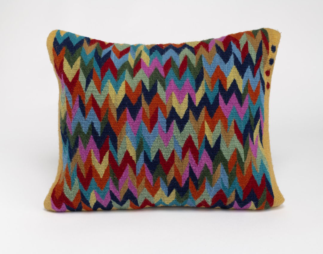 HANDWOVEN PILLOWCASE with multicolored chevron pattern SIGNED WITH FOUR DOTS.