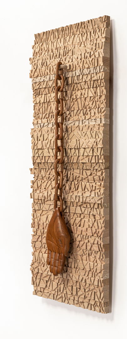 Materials: Red oak (background)  Weeping Cherry (hand and chain).