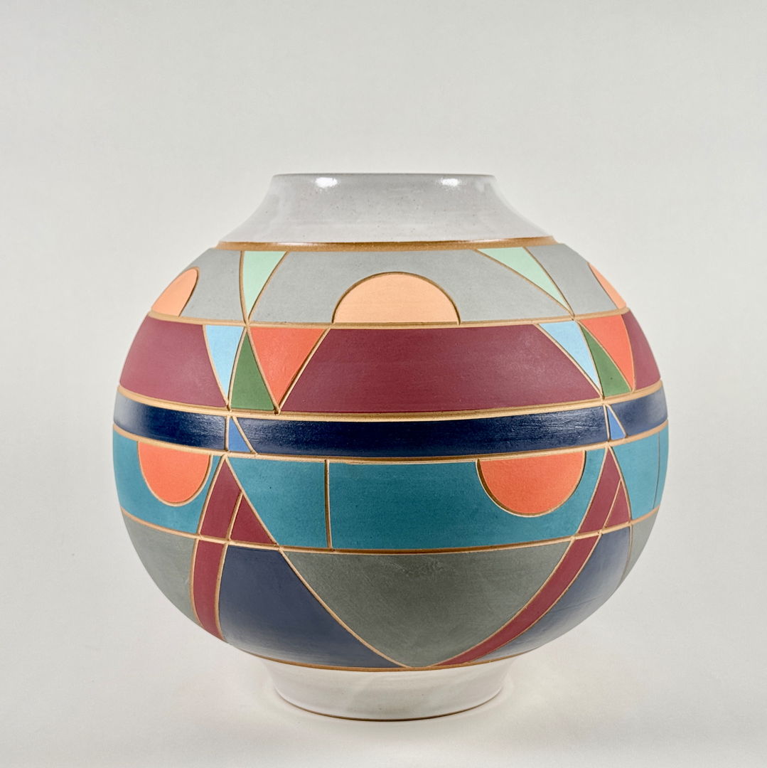 This globe vase evokes geometric and geologic realms  and is as functional as it is visually interesting. Made of brown stoneware with a satin white glaze  various colored underglazes  and is carefully carved.