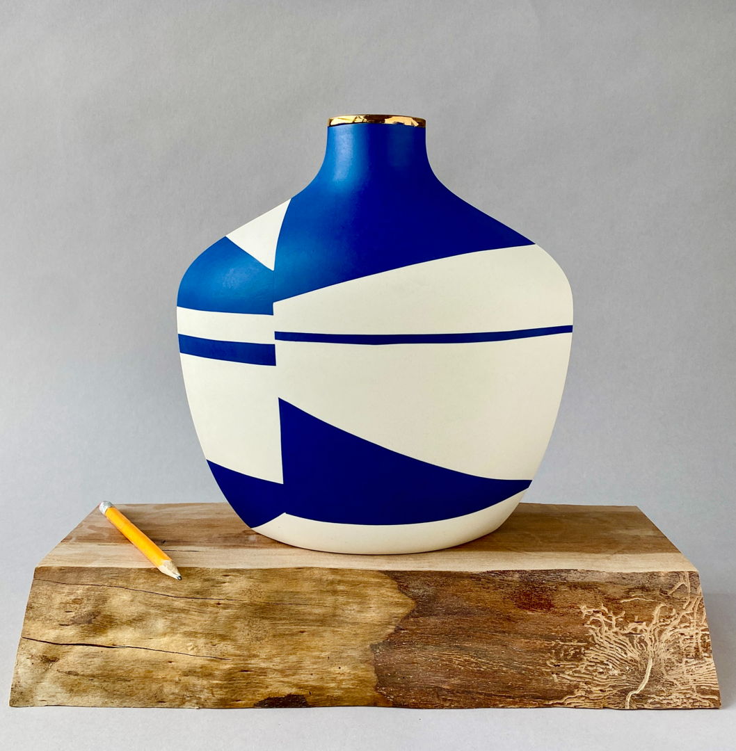 Made from thin slabs of pigmented porcelain fitted together and sanded  backed with white porcelain  cone 7 fired; additional 22k gold luster firing. Surface shows abstract imagery of locations and narratives intimate to me.