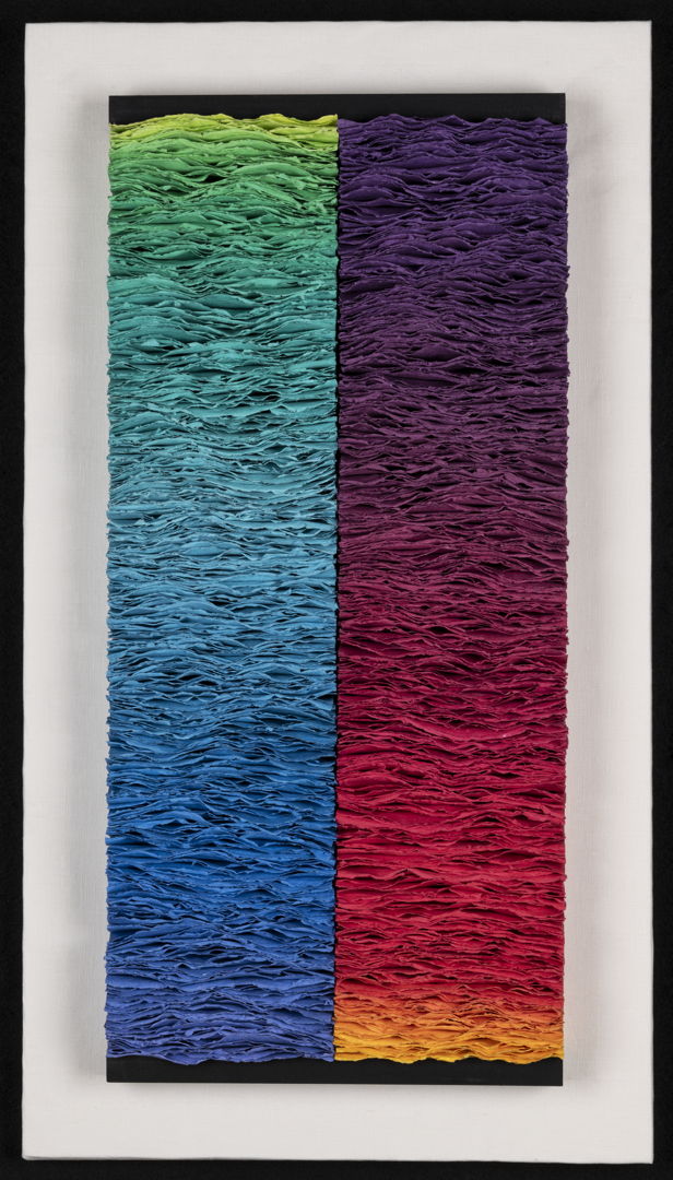 Pigmented abaca/linen paper  produced in gradation of color  assembled in stacks.