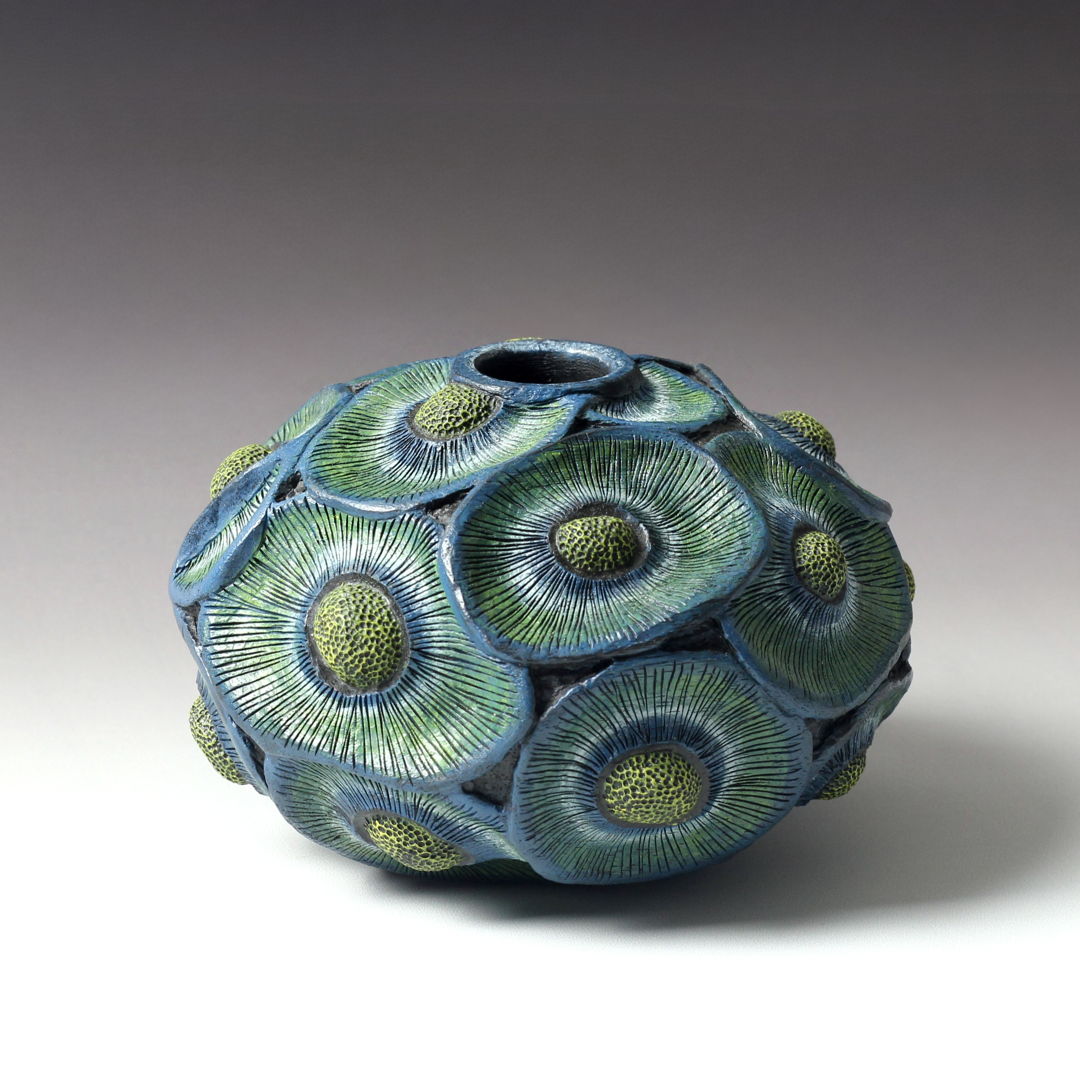 Black walnut hollow form with relief carving  pyrography  and dry brushed acrylics all from one piece of wood.