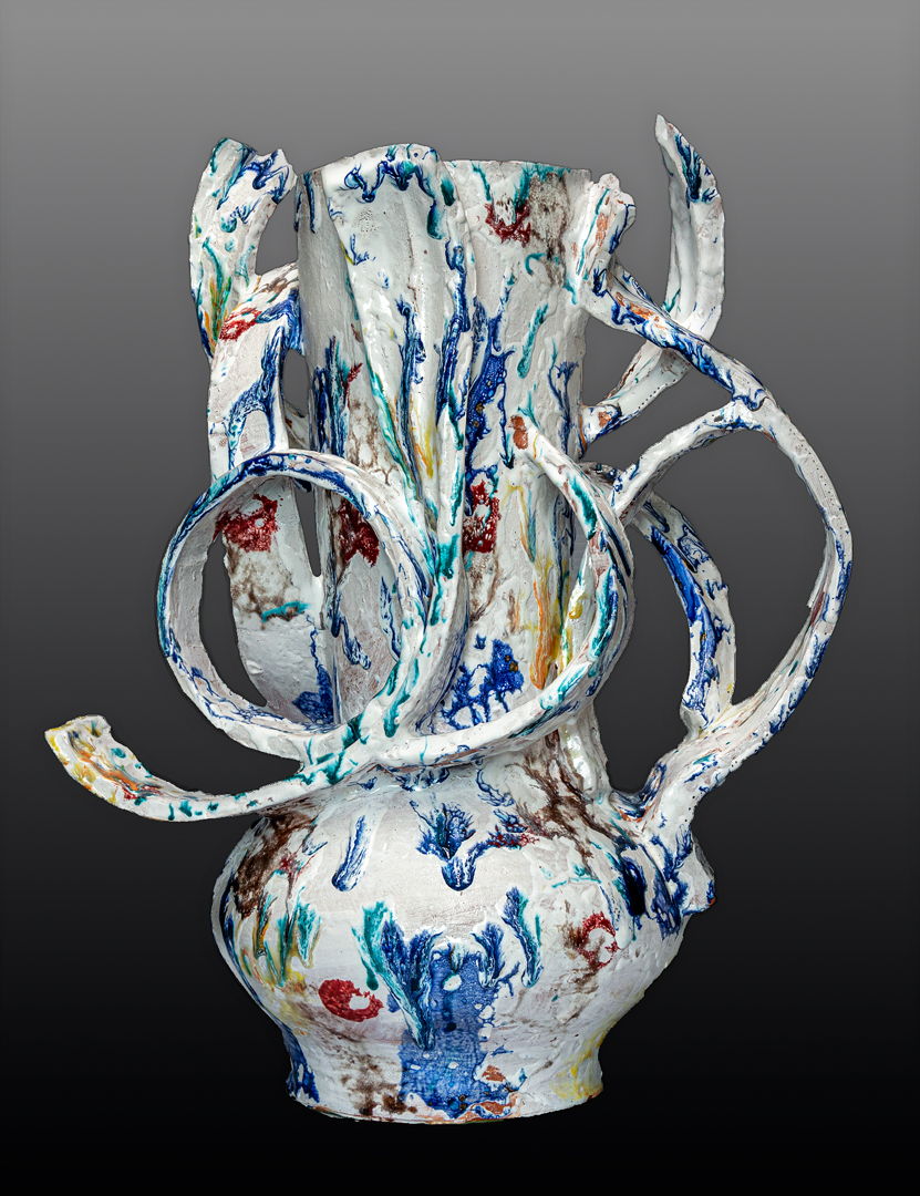 Handformed earthenware vessel sculpture created using a series of slumped forms parts of which are assembled and manipulated into one of a kind artworks multifired for desired effects