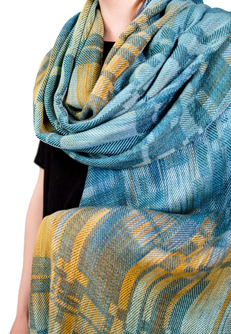 Handwoven shawl  hand painted warp and hand dyed tencel a sustainable yarn from Eucalyptus trees. Woven in original pattern on a floor loom. Colors and pattern pay homage to the Blue Earred Kingfisher with vibrant oranges blues and teal.