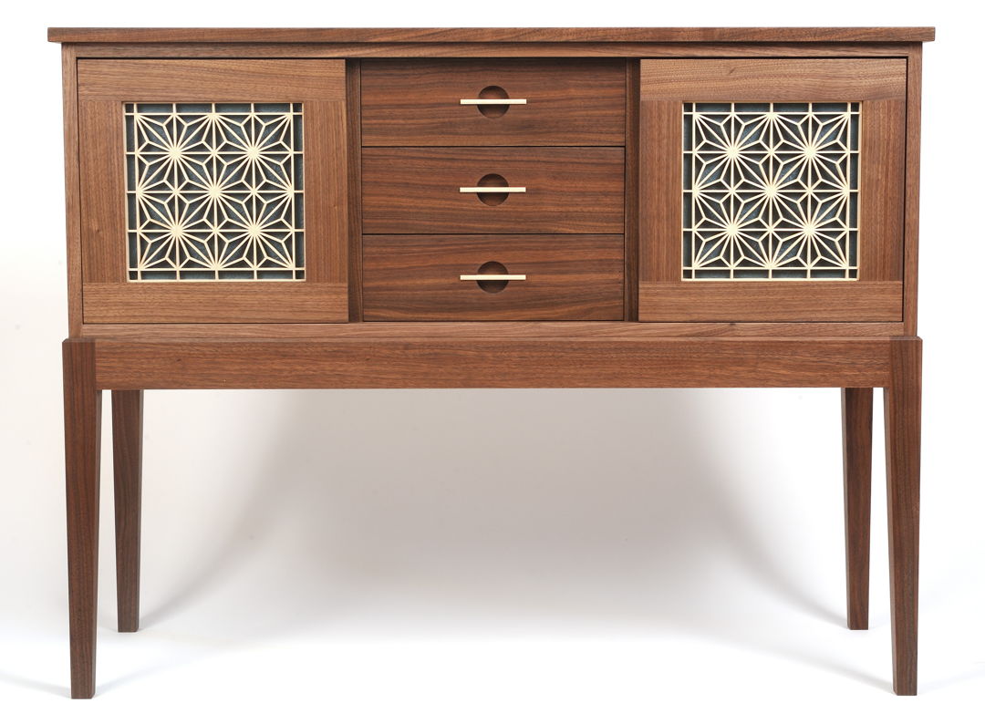 Walnut sideboard featuring sliding basswood kumiko panel doors backed with blue crinkled Momigami paper.