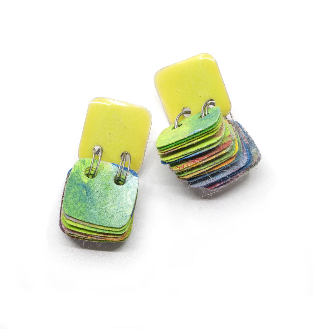 Book inspired earrings made with 'pages' of hand painted   non woven polyester combined with resin coated sterling silver. These earrings have sterling silver posts an ear nuts.