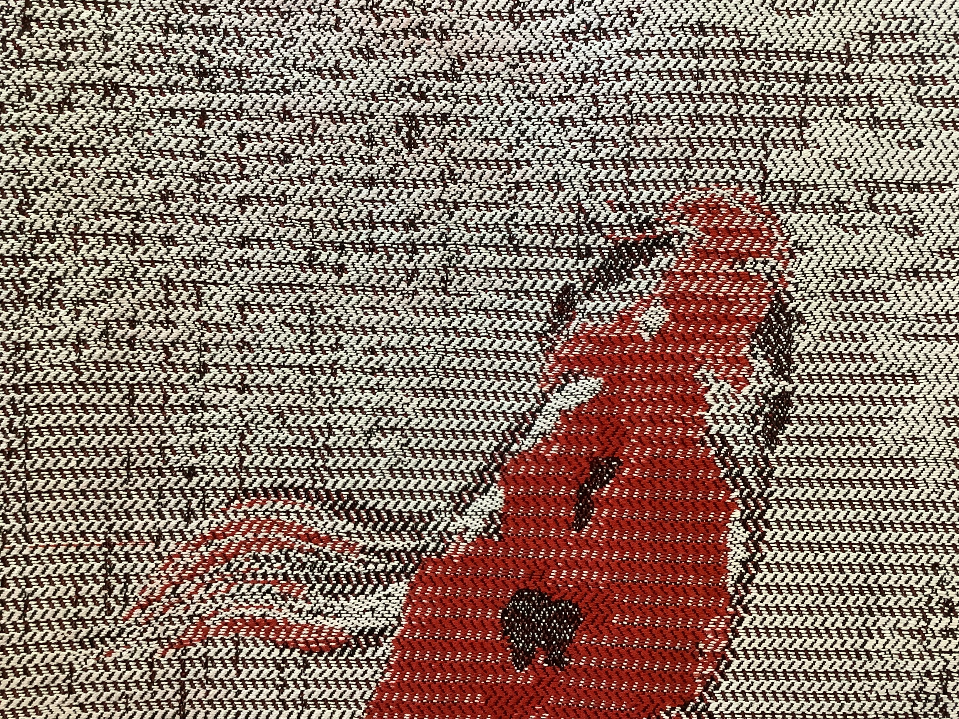 detail of woven image of koi