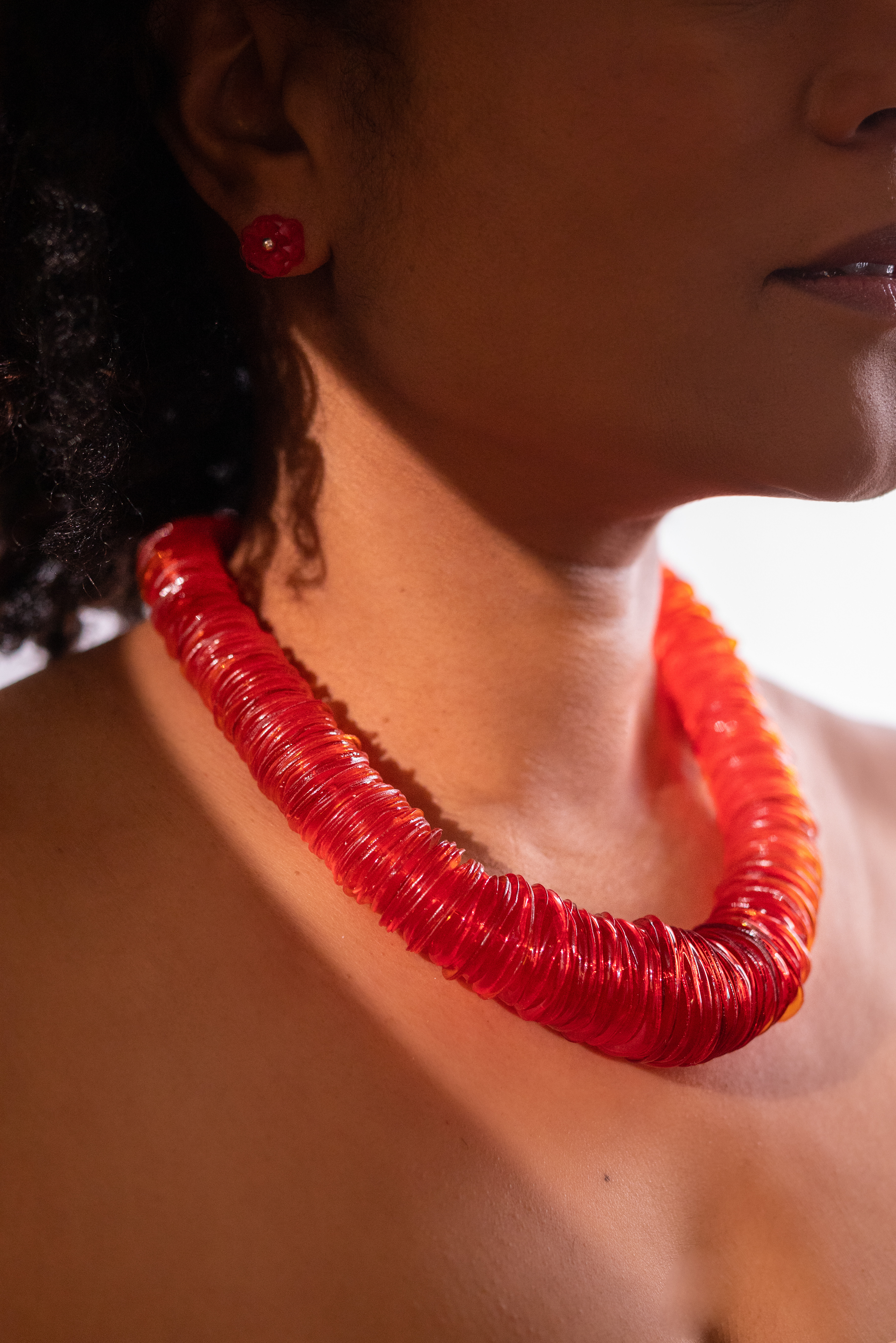 statement necklace with many red disk beads