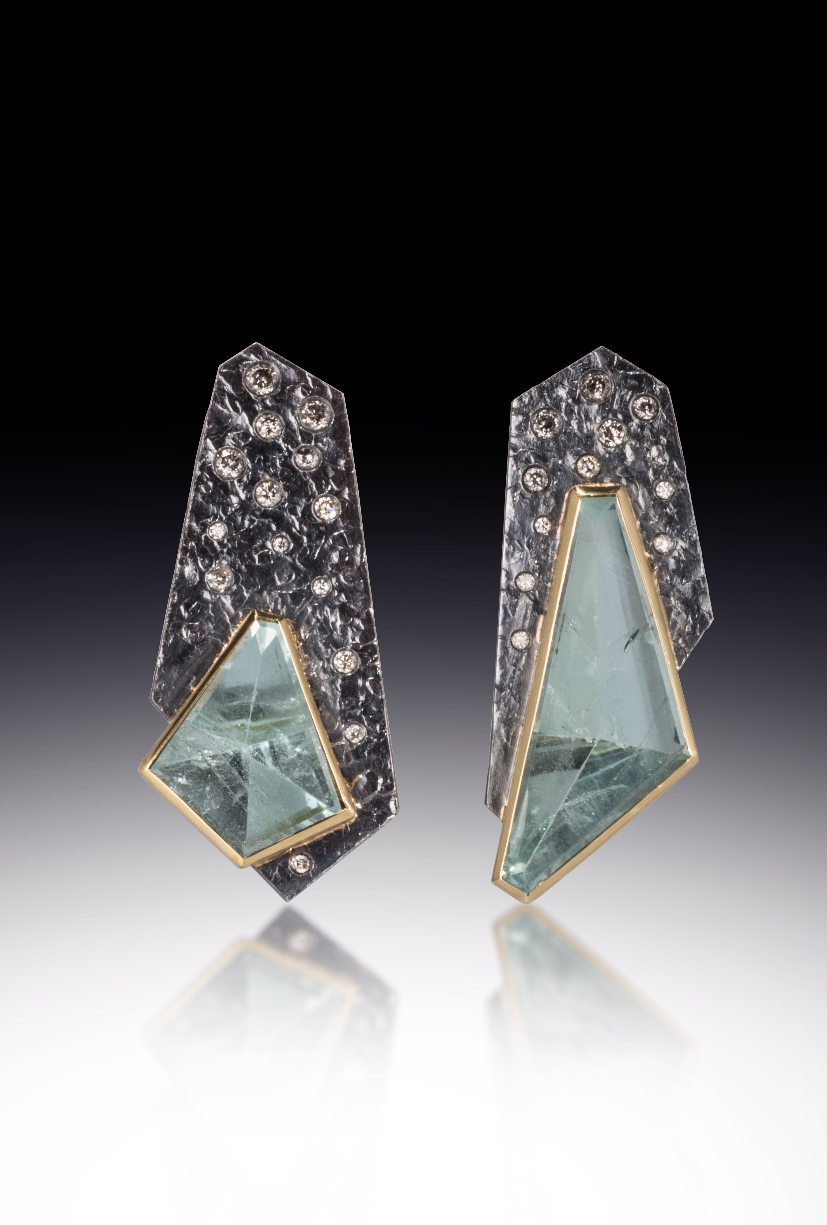 two asymmetric earrings