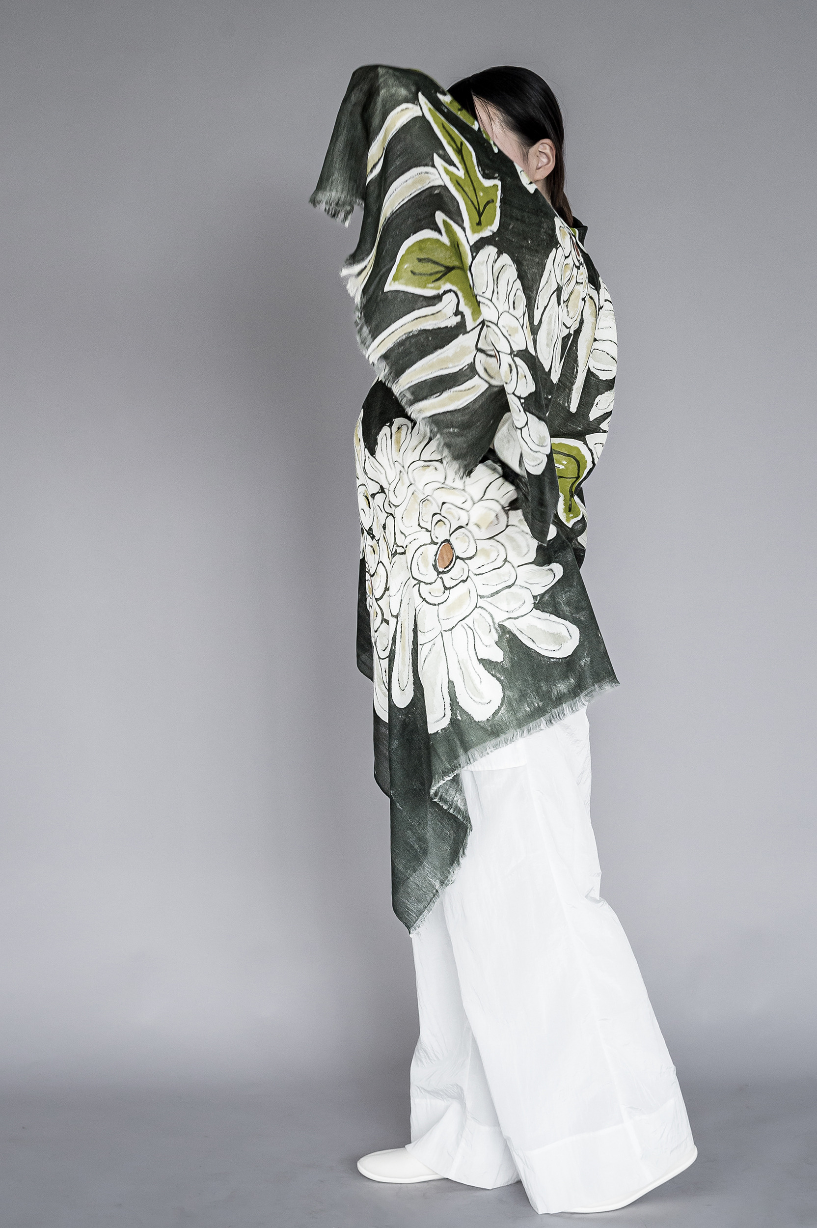 model wearing large print floral shawl