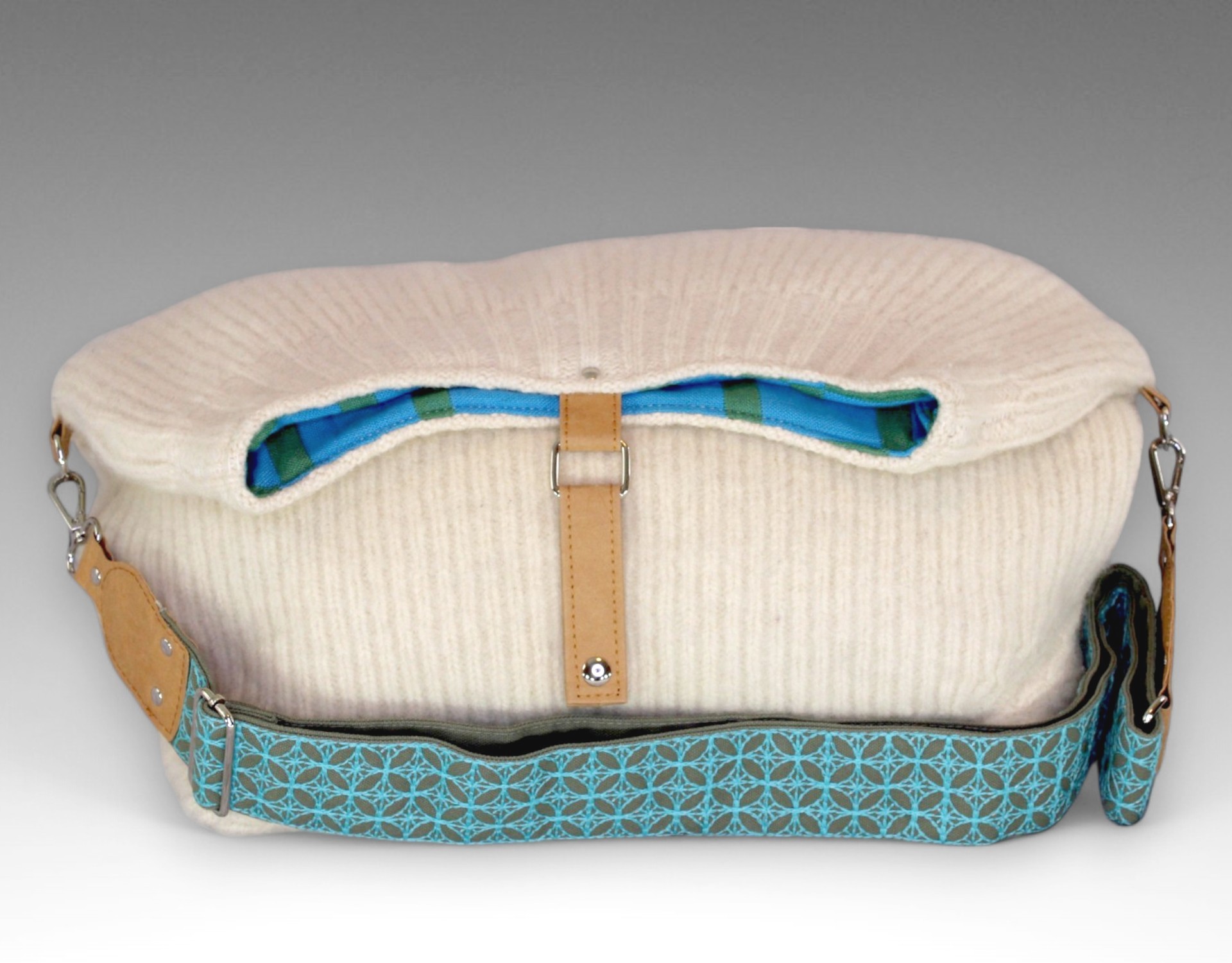 white purse with blue patterned strap