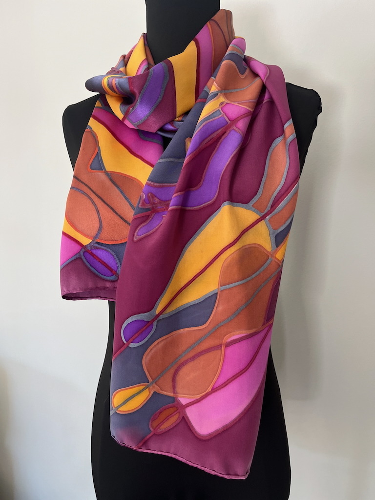 large print scarf with purples and oranges