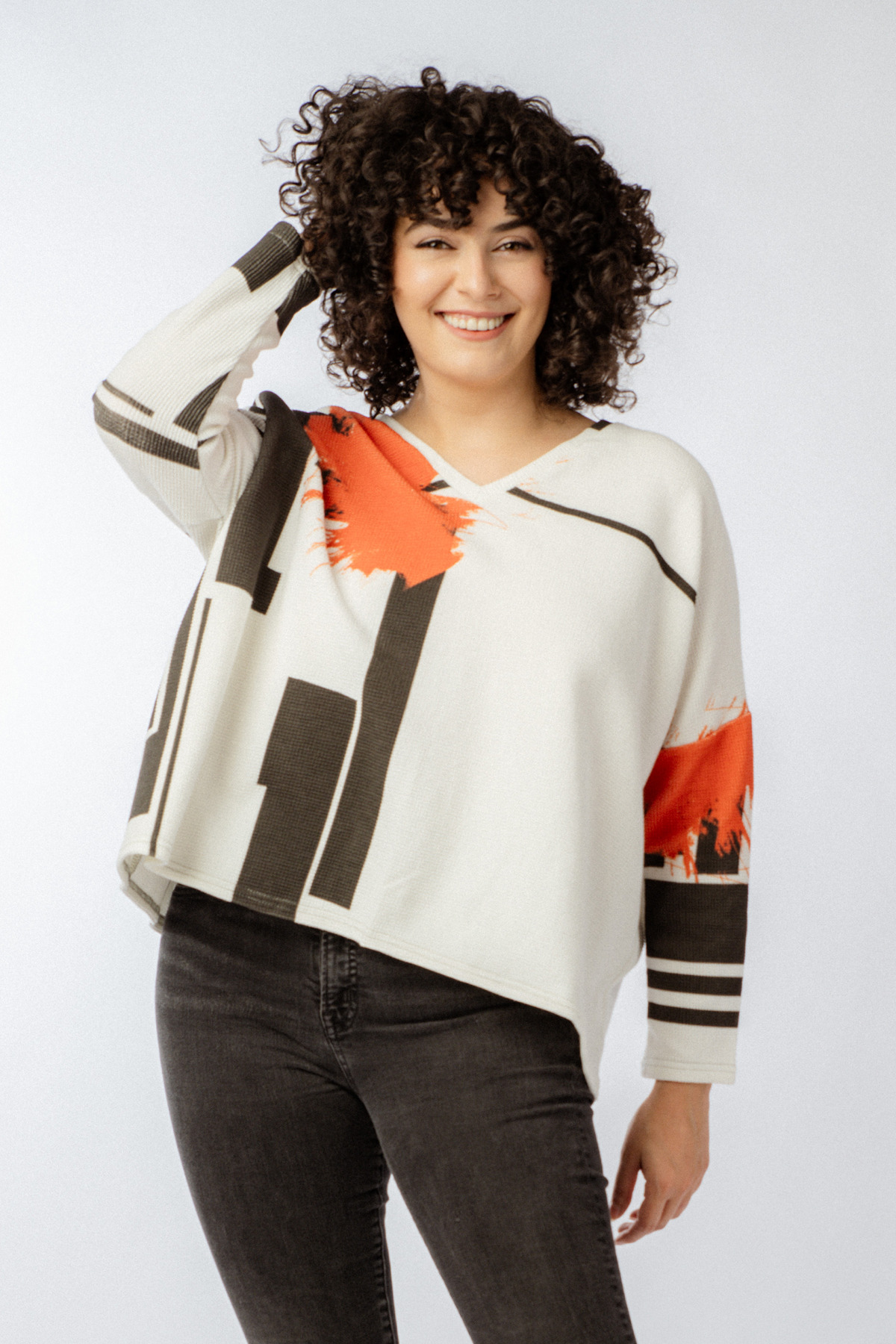 black and white top with splash of orange